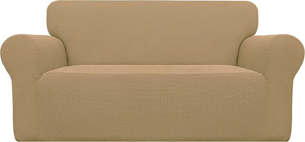 Centered front view of a tan/beige loveseat cover showing pronounced rolled arms and a waffle-like fabric texture.