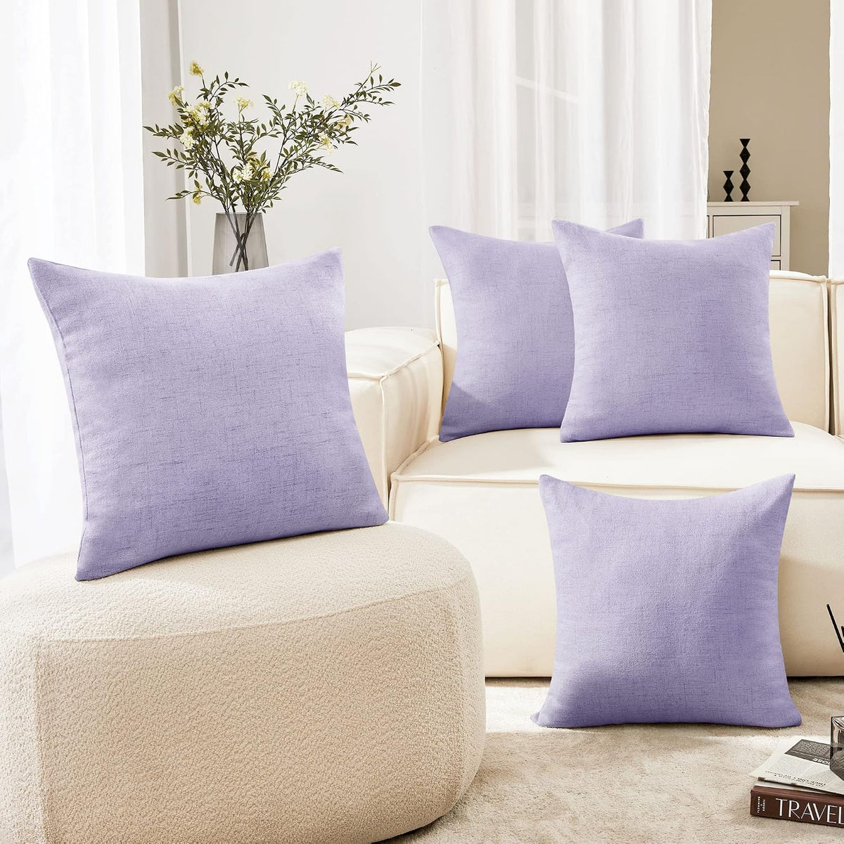 Living room scene with four lavender square throw pillow covers arranged on a cream sofa.