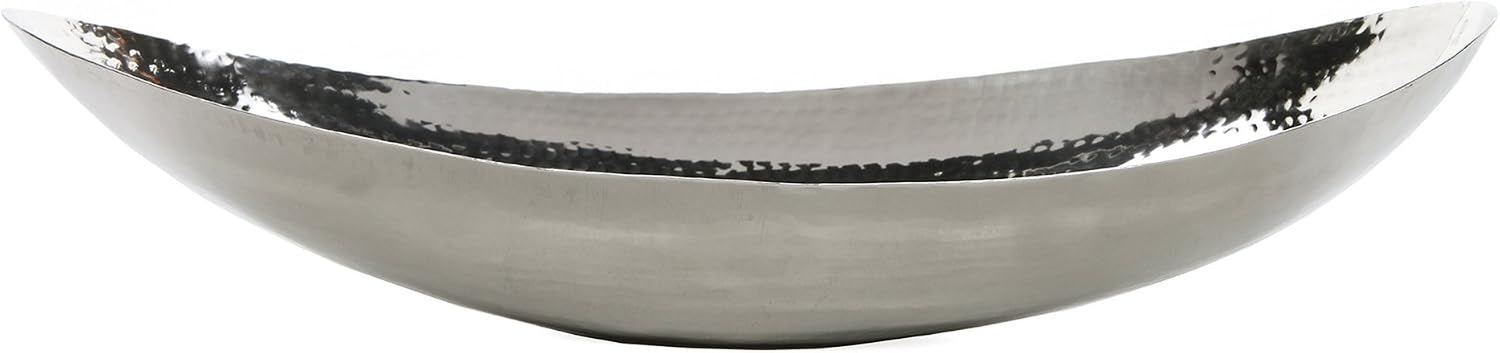 Hammered stainless steel oval bowl side profile on white background highlighting curved rim and finish