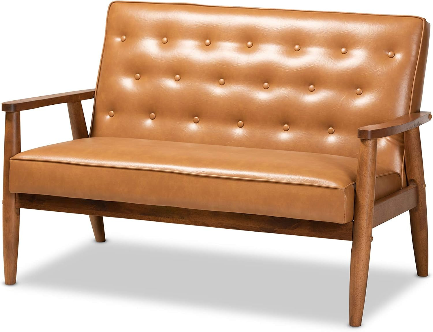 Tan faux leather loveseat angled front view showing button tufting and walnut brown wooden legs