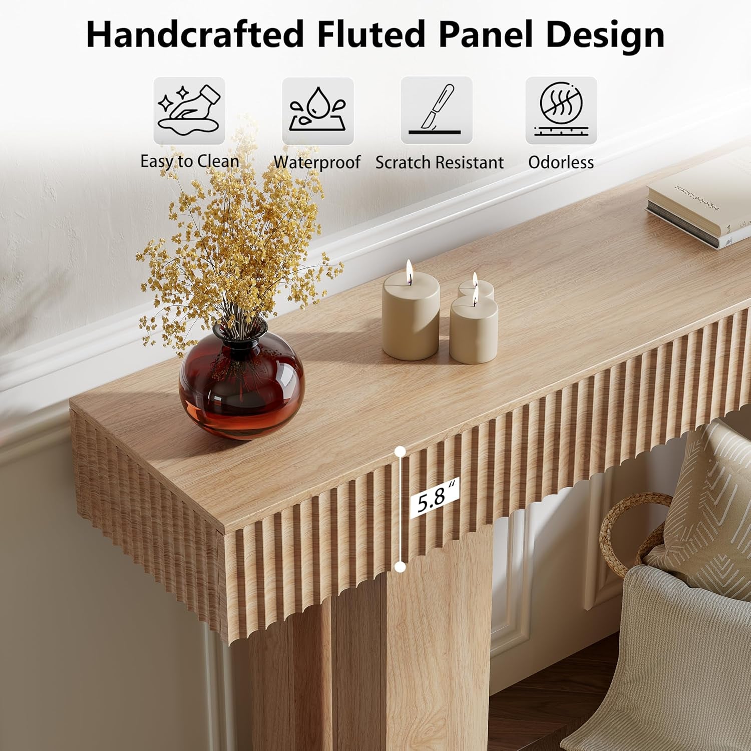 Close-up of the fluted front edge and tabletop in natural oak with a vase and lit candles