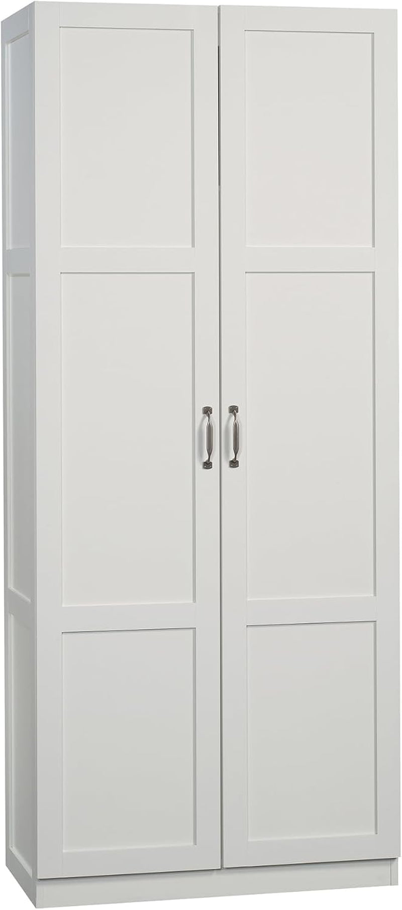Slim white pantry cabinet with recessed rectangular door panels and brushed metal handles.