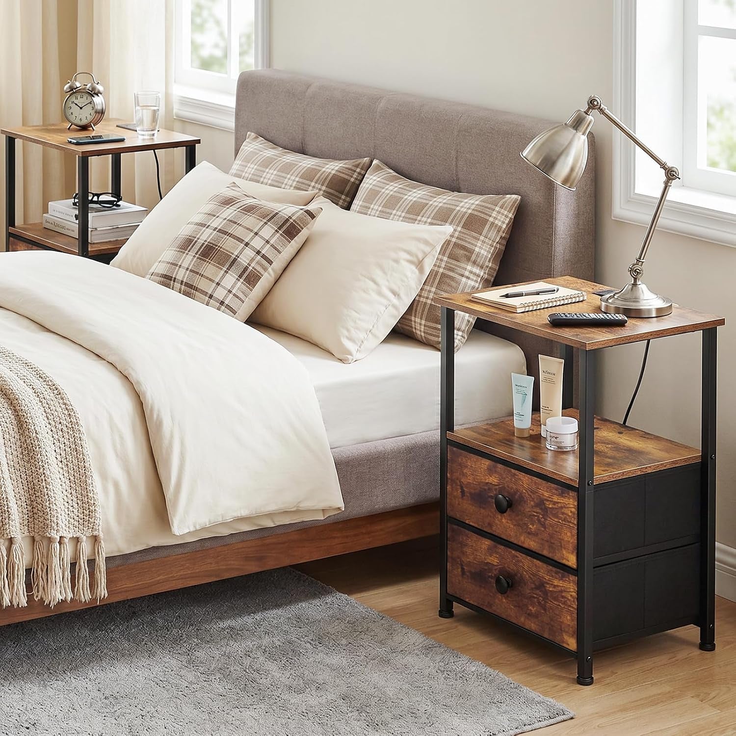 Nightstand used as bedside table next to bed with lamp, toiletries on middle shelf and two drawers below
