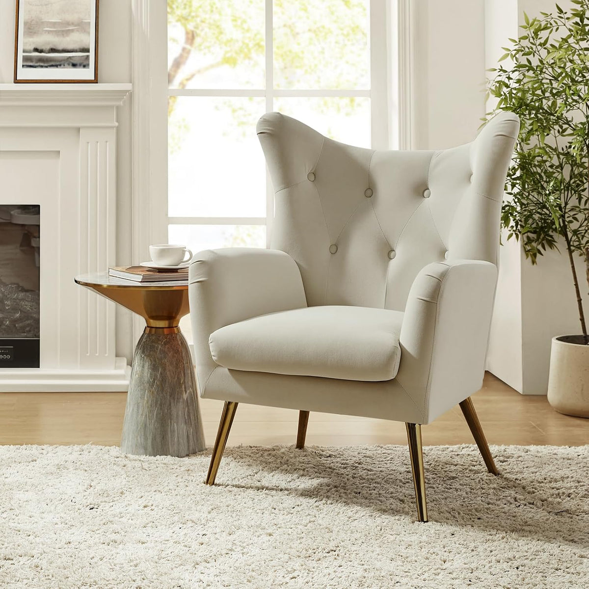 Off-white wingback chair shown in profile with a fireplace mantel and potted plant in the background.