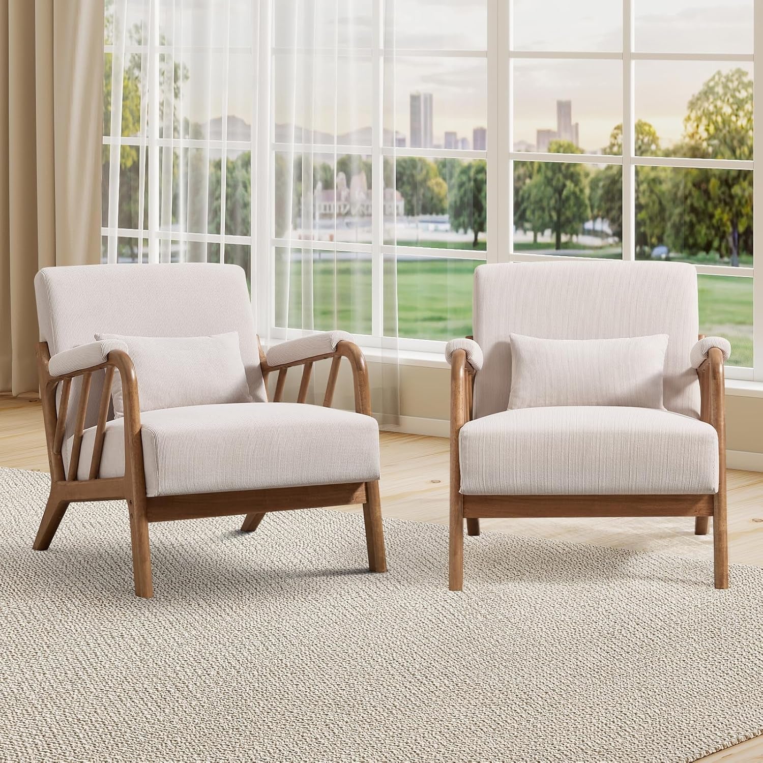 Two light beige wood-framed accent chairs placed side by side in front of a large window.