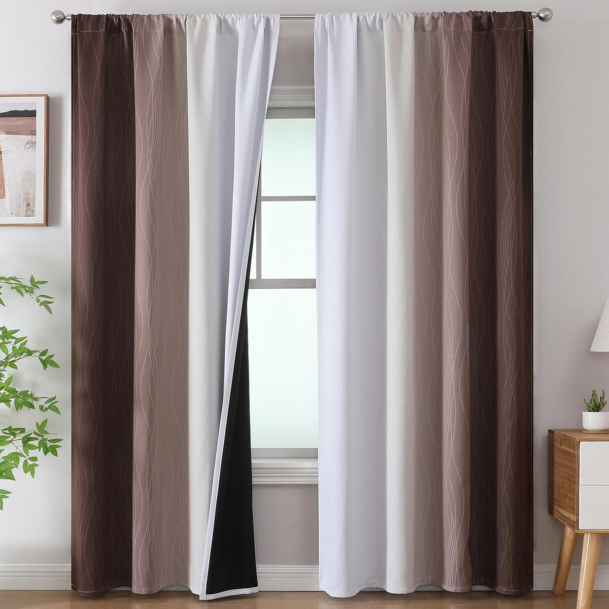 Front view of two-panel ombre curtains showing white center panels and darker grey outer panels over a window