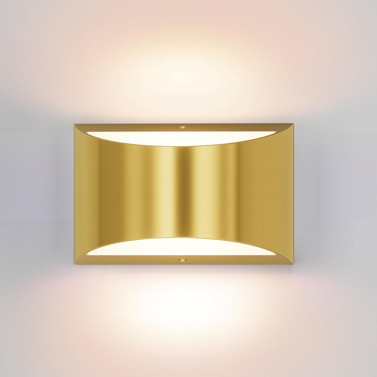 Single gold rectangular wall sconce mounted on a wall, emitting soft warm light up and down.