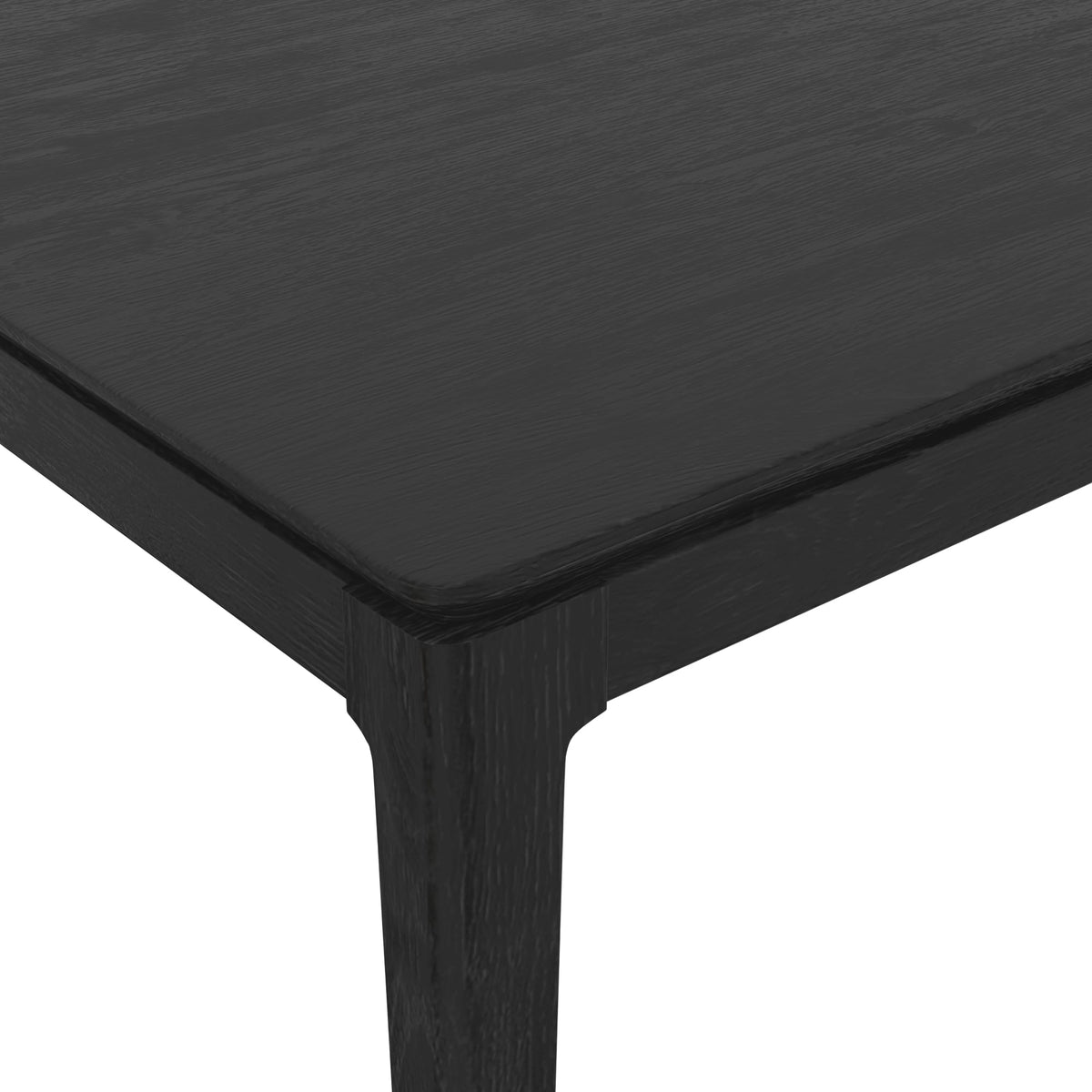 Close-up of a rounded tabletop corner and thick leg with dark wood grain.