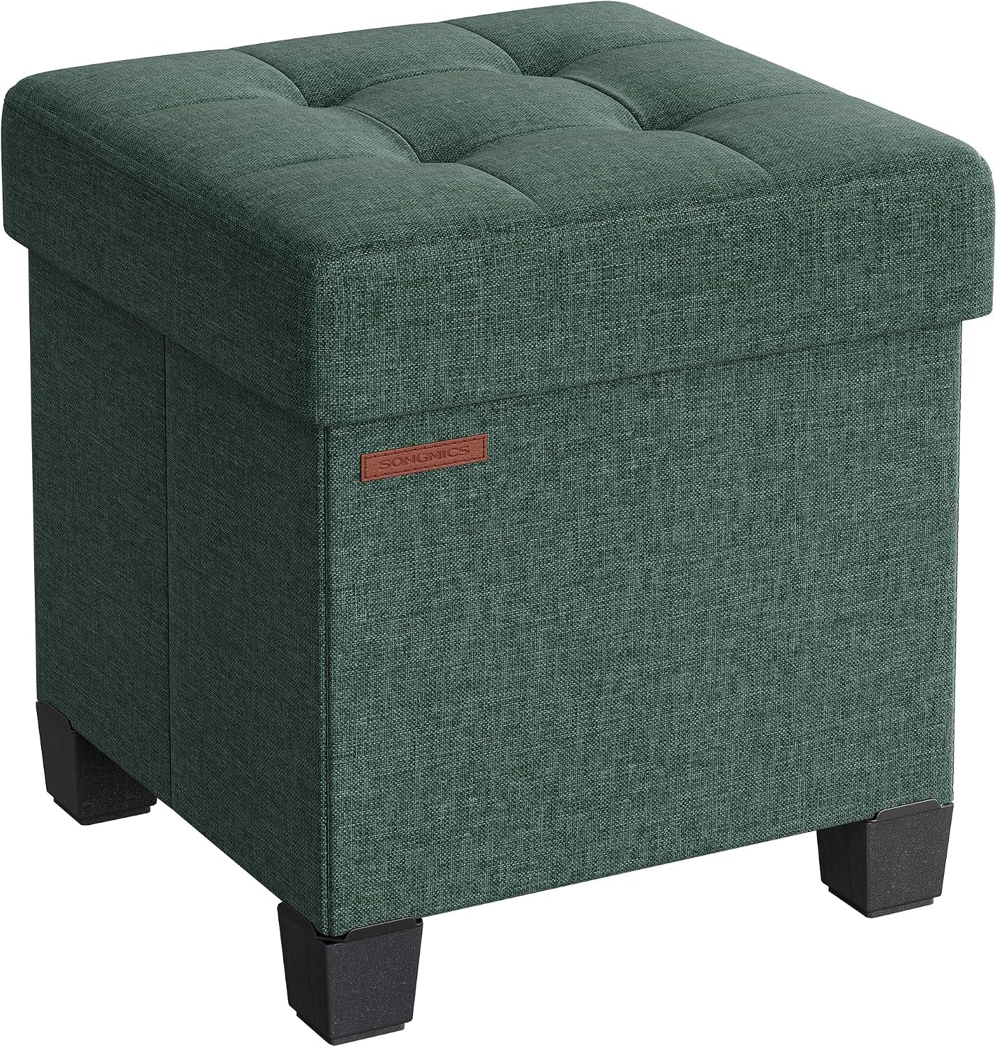 Three-quarter view of a deep green linen-look storage ottoman with tufted cushion top and black legs