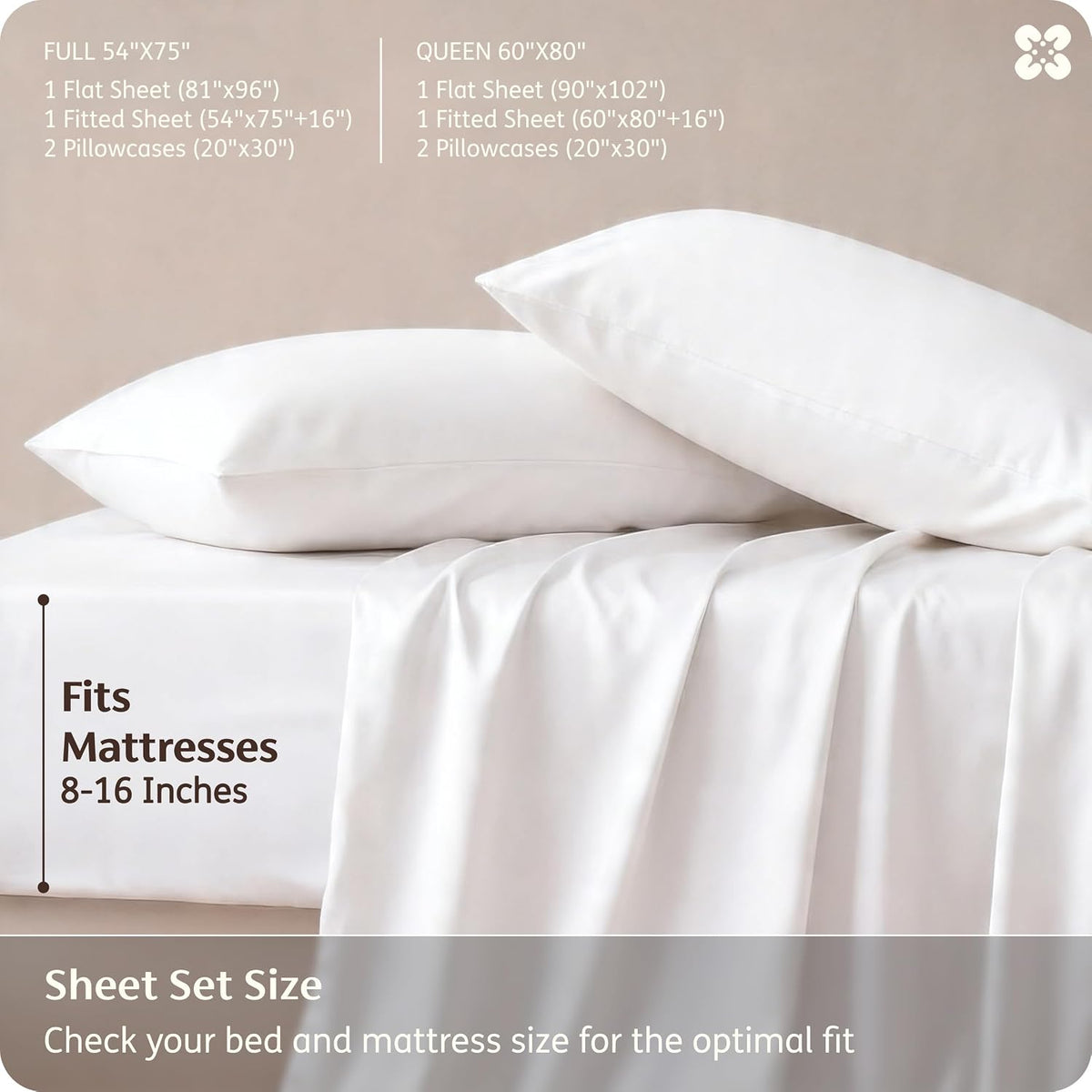 Two white pillows stacked on a mattress with a draped white sheet at the edge.