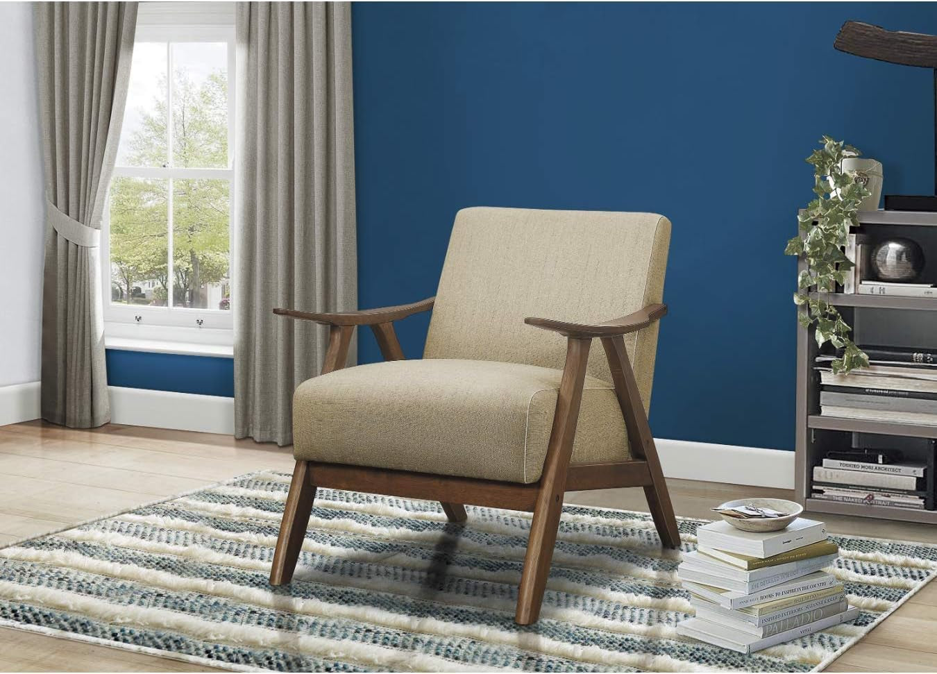 Beige linen-look accent chair with walnut frame placed on rug in a bright windowed room