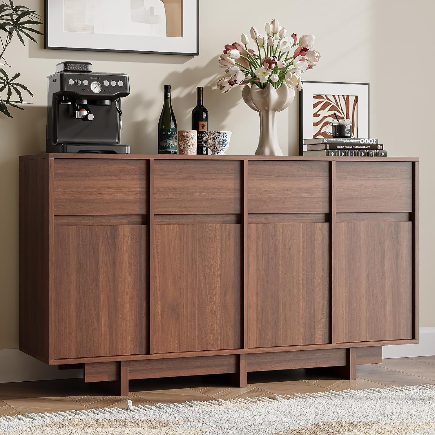 Front-facing walnut buffet cropped to show recessed plinth base, parquet floor and textured rug.