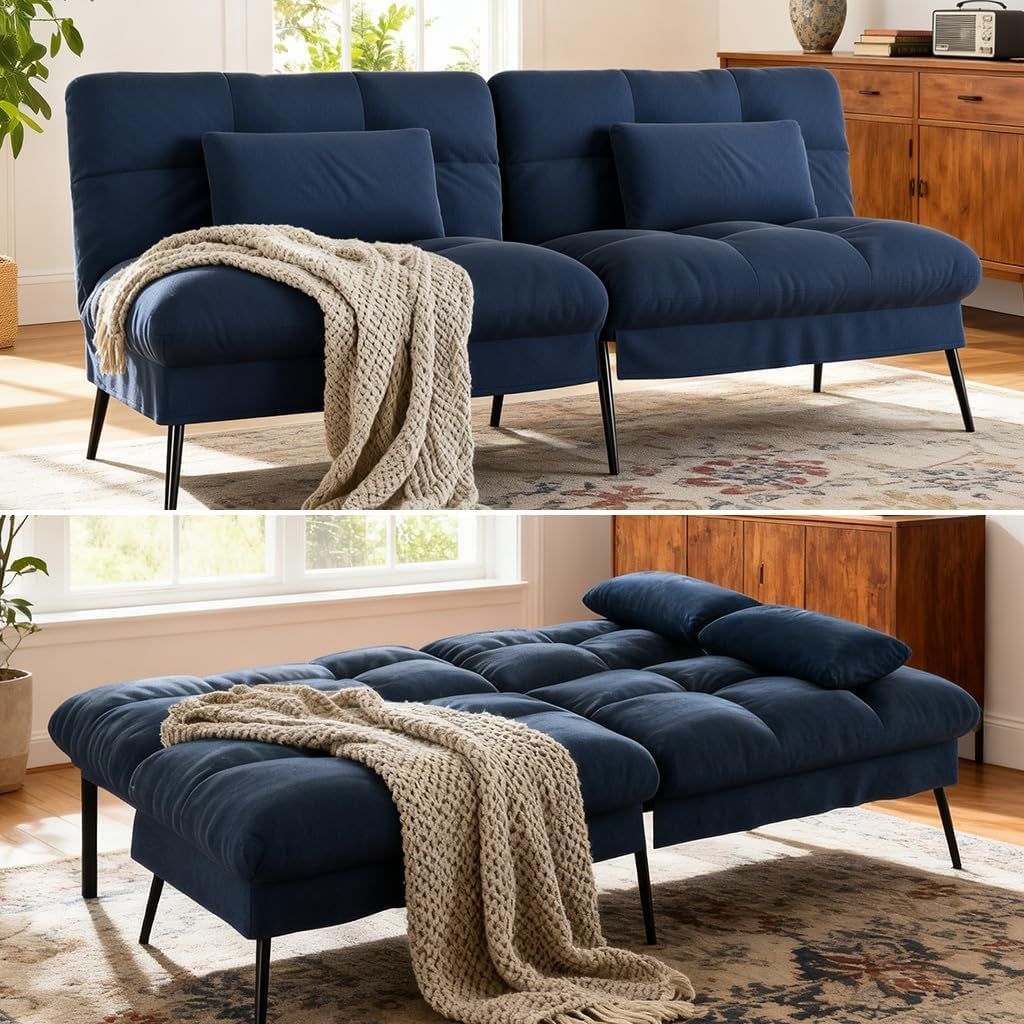 Navy blue futon shown upright as a two-seater and converted flat as a bed in a living room.