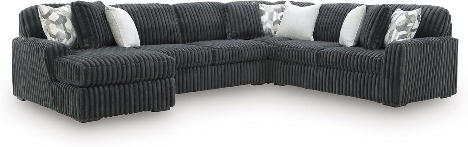 Three-quarter corner view of a dark charcoal ribbed sectional showing deep channeling and low square feet.