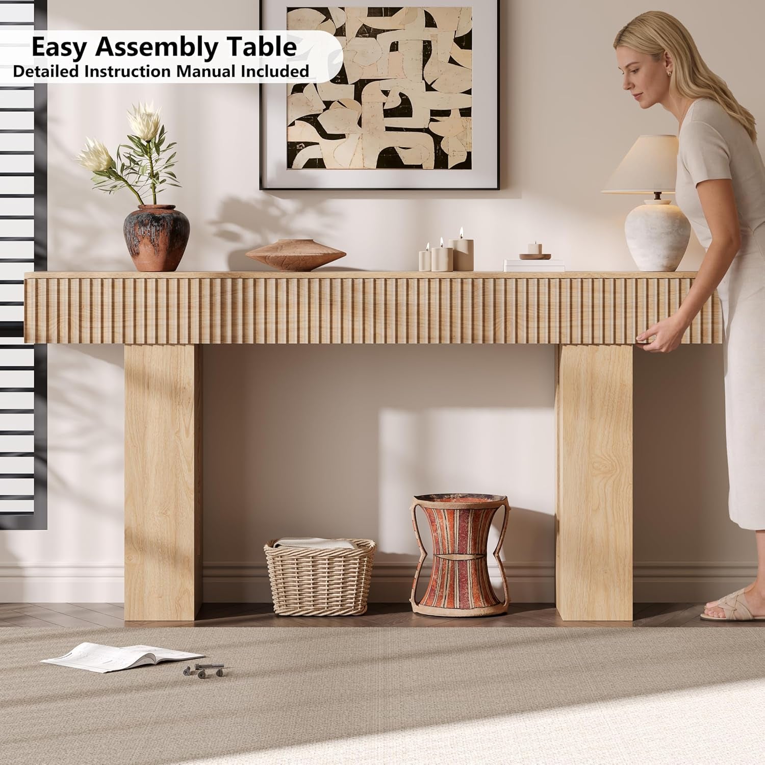 Woman adjusting the console's right edge with woven basket and decorative drum under the table.