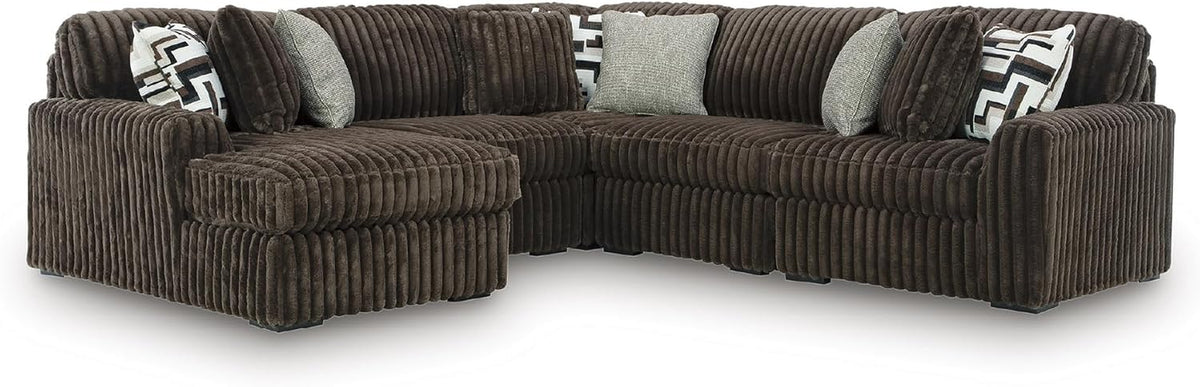 Chocolate-brown oversized corduroy sectional with left chaise and patterned accent pillows