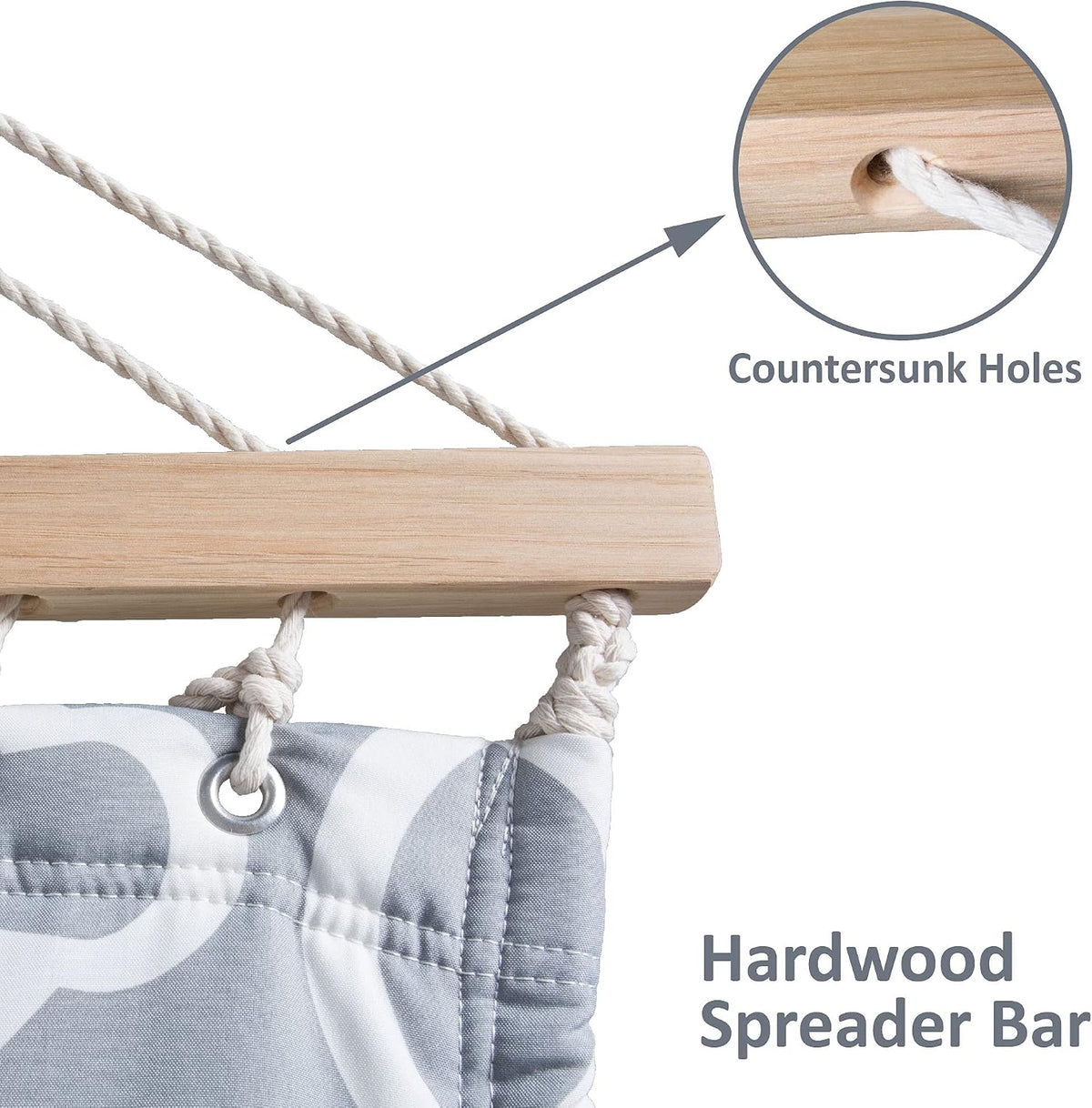 Close-up of hardwood spreader bar showing countersunk rope holes and thick hand-woven poly-cotton ropes