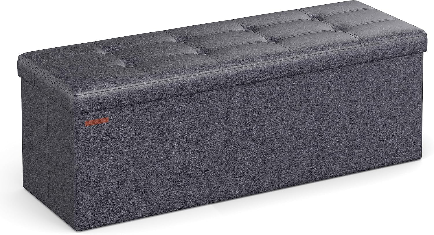 Dark charcoal tufted faux-leather storage ottoman bench shown at an angle with visible stitching and side tag.
