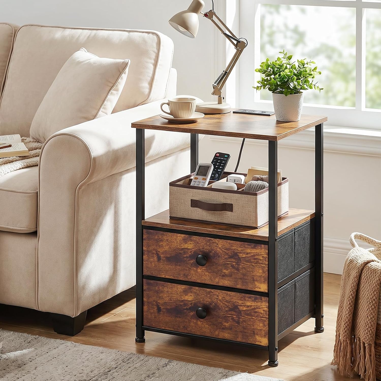 Rustic brown two-drawer nightstand beside a beige sofa with lamp and potted plant on top