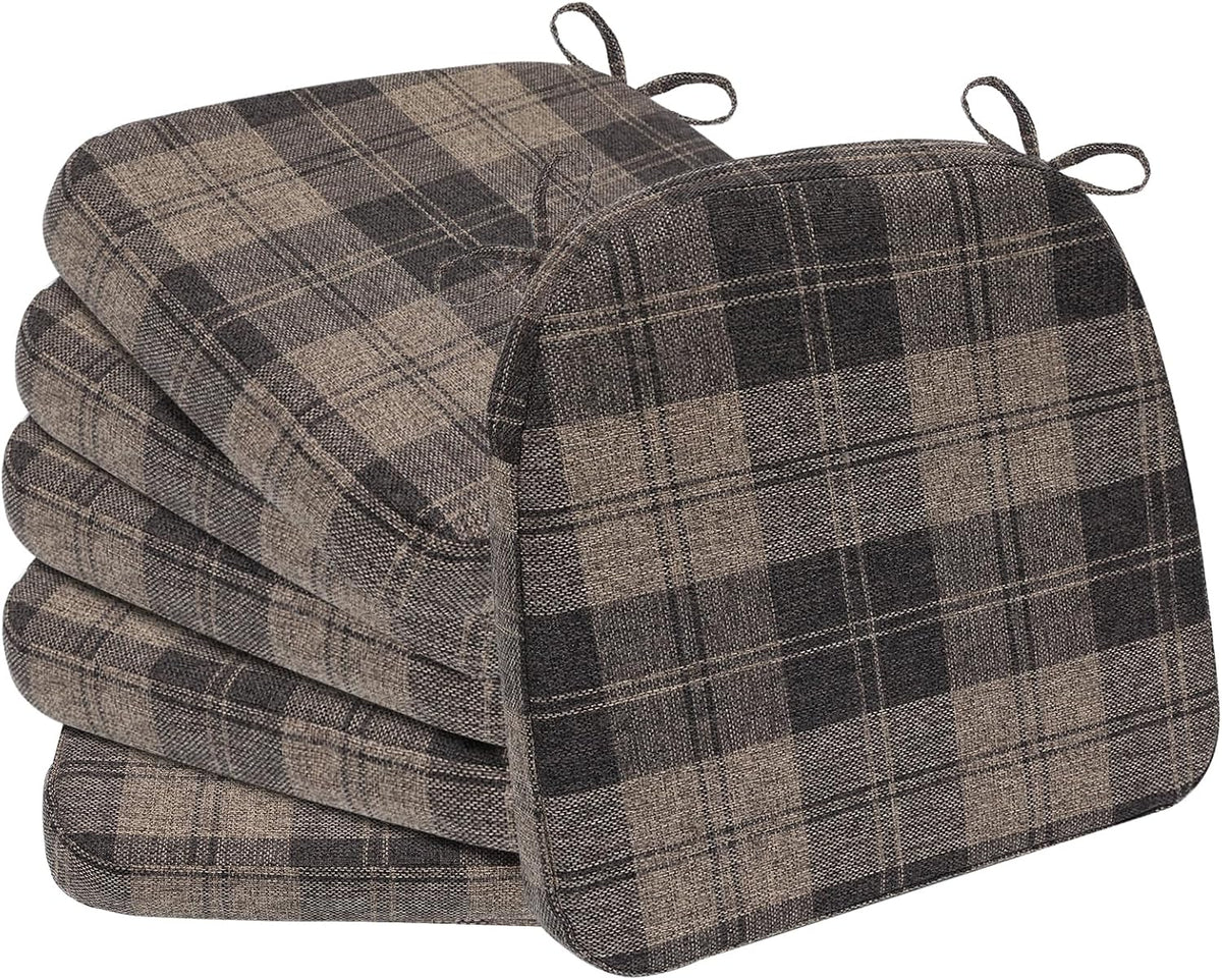 Set of four D-shaped seat cushions in a brown and tan plaid fabric with bow ties at the corners