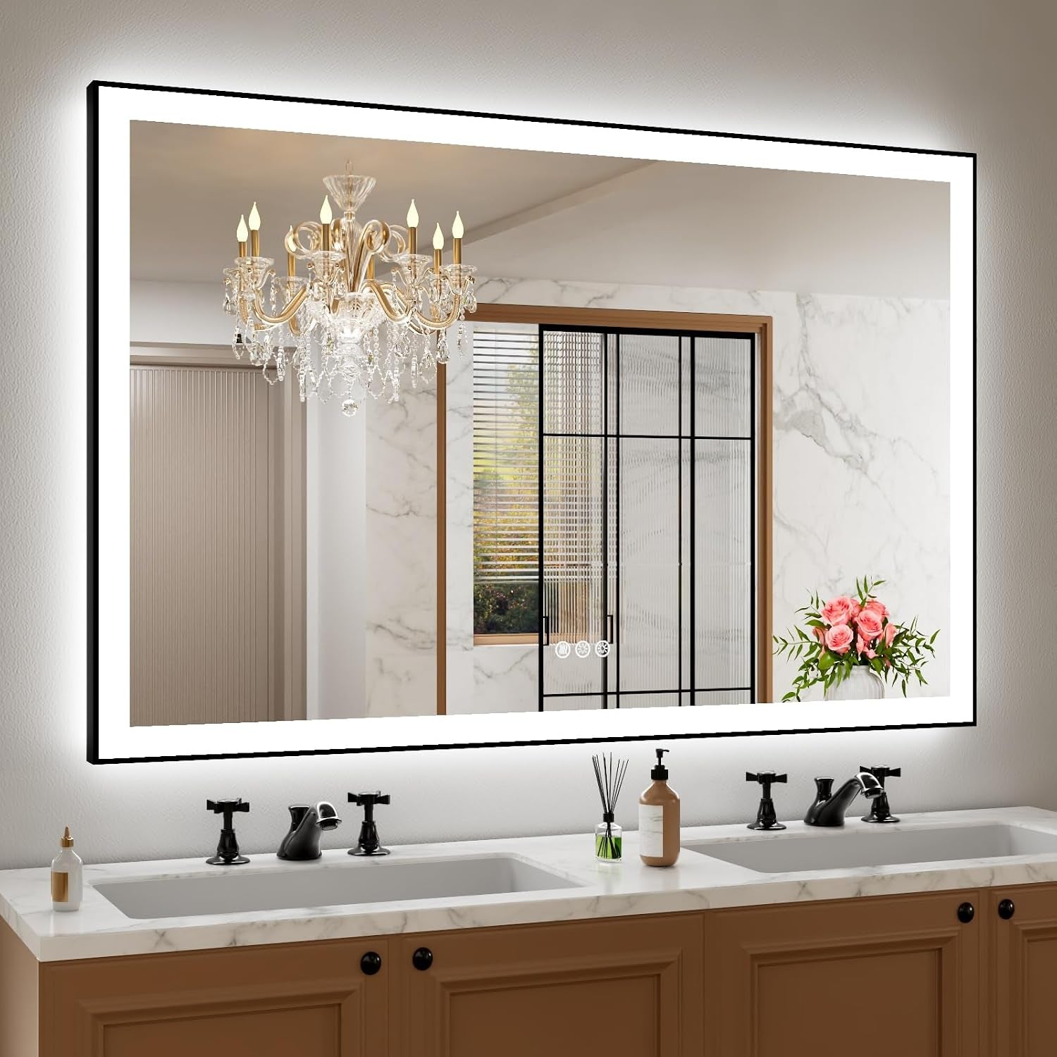 Large rectangular LED mirror above a double vanity, showing chandelier and window reflections and a lit inner frame with