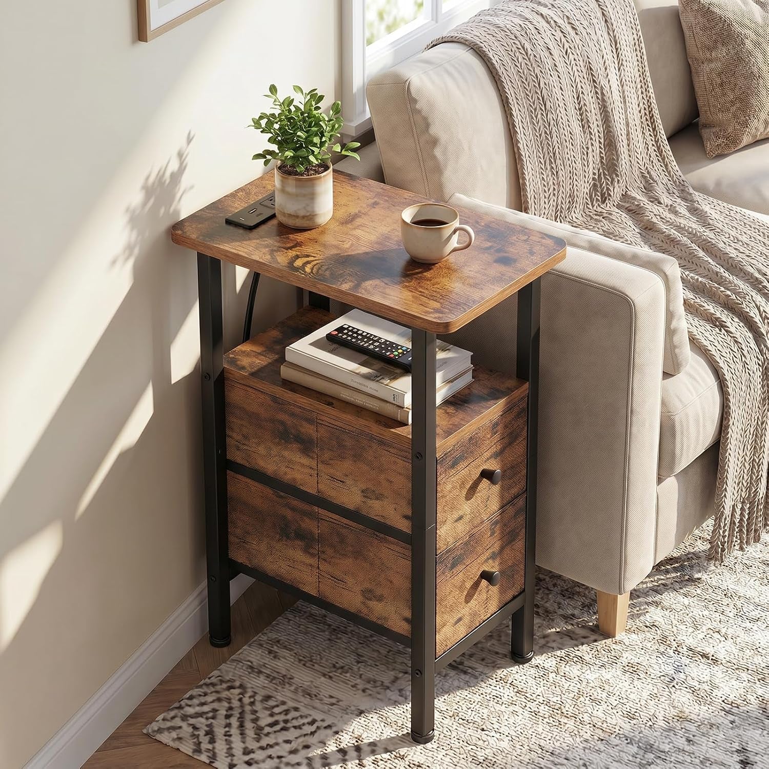 Narrow rustic brown end table next to a beige sofa holding a plant and coffee mug.