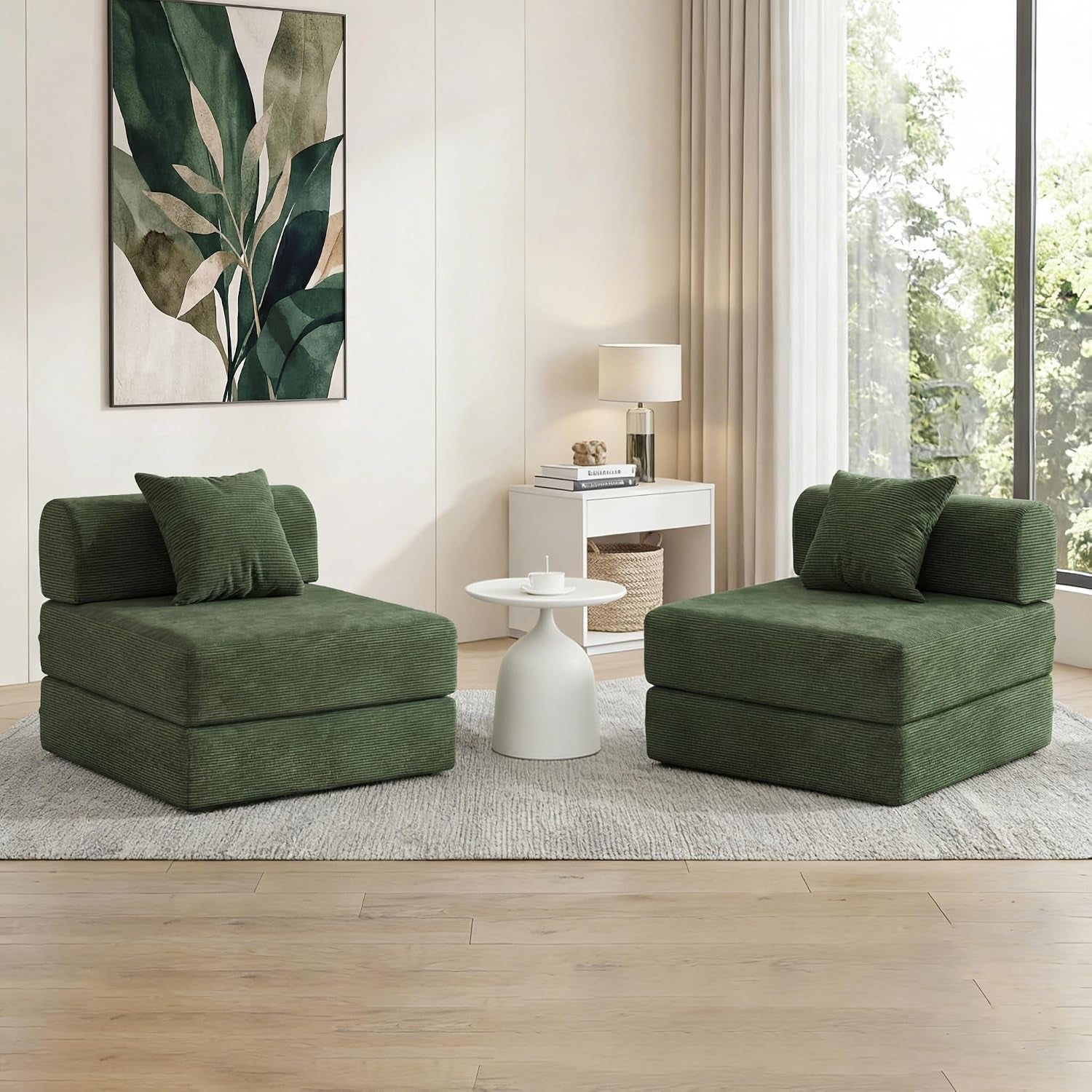 Two forest-green corduroy folding seats facing each other with a small round table between them