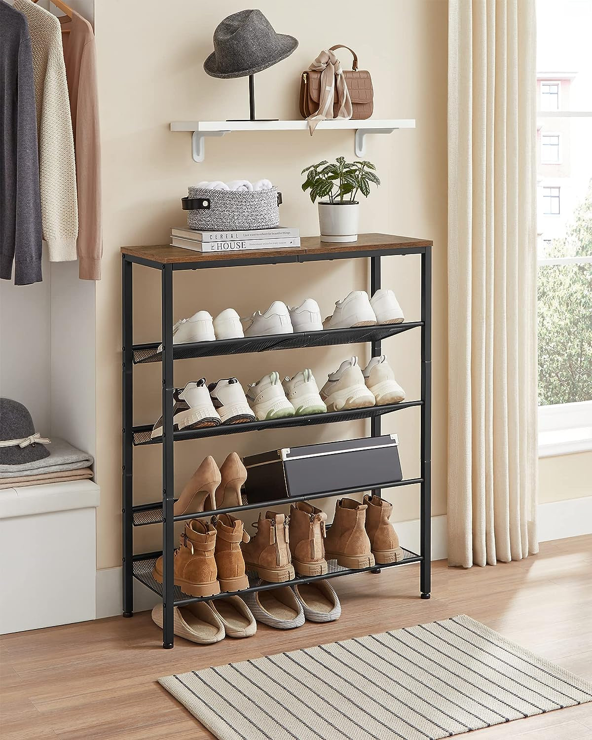 Five-tier shoe rack placed against a wall in an entryway holding sneakers, heels and boots with a wood top.