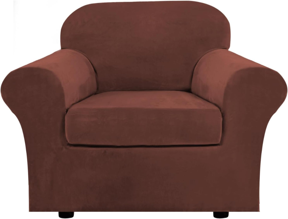 Front view of a chocolate-brown velvet slipcovered armchair showing rounded armrests and seat cushion.