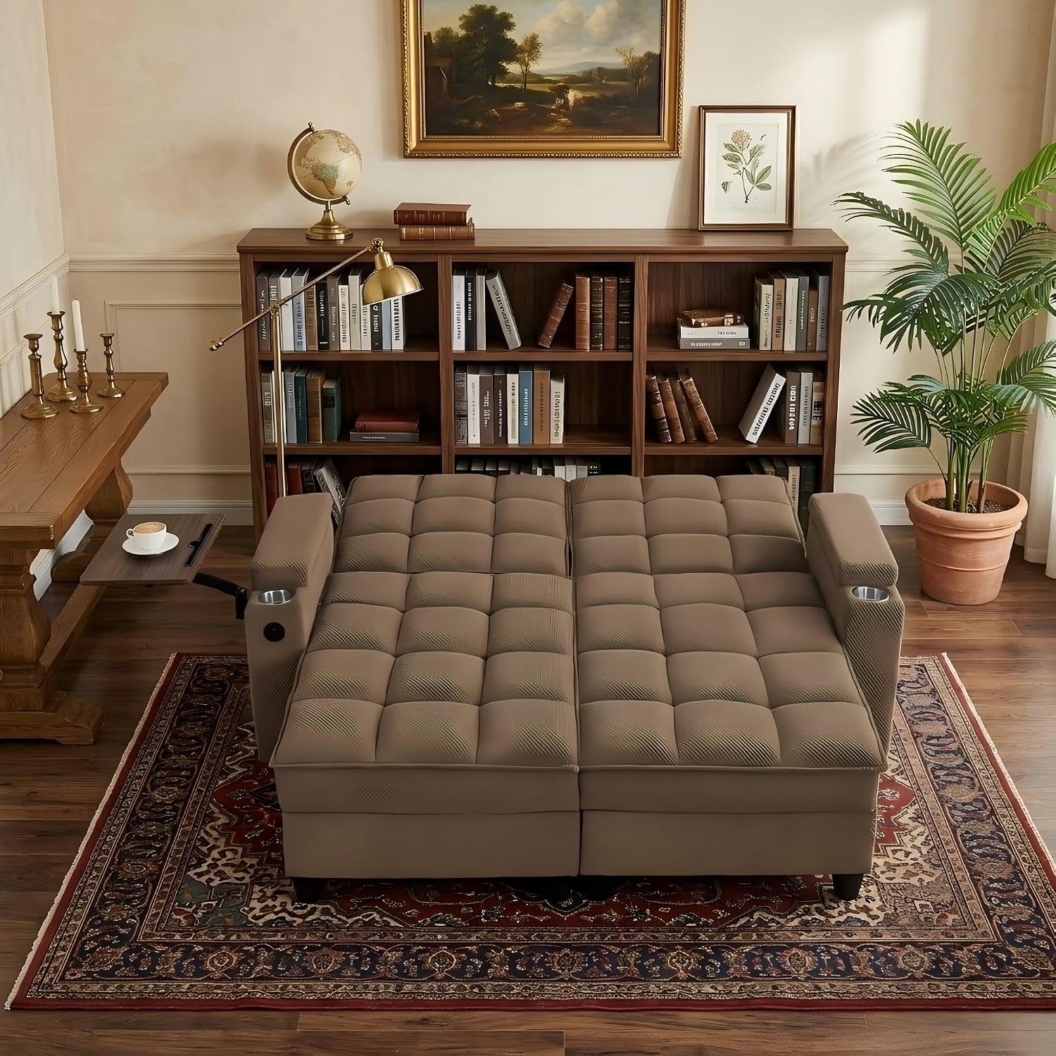 Brown tufted chaise opened flat into a sleeper centered on a patterned rug in a library-style room