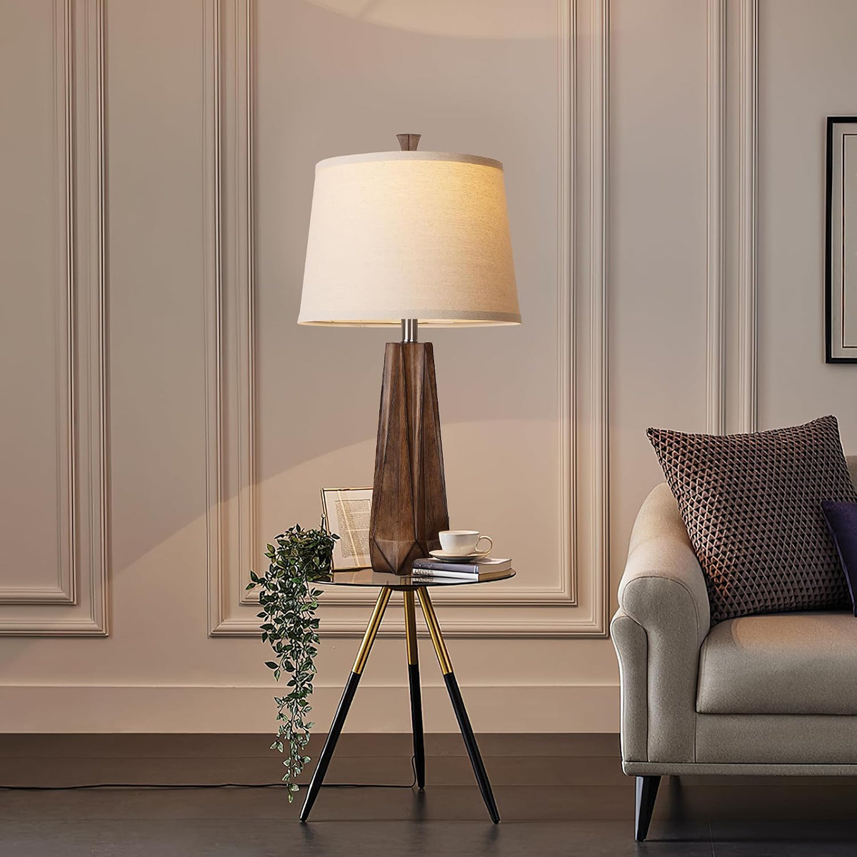 Wood-grain resin table lamp on a tripod side table in a living room setting