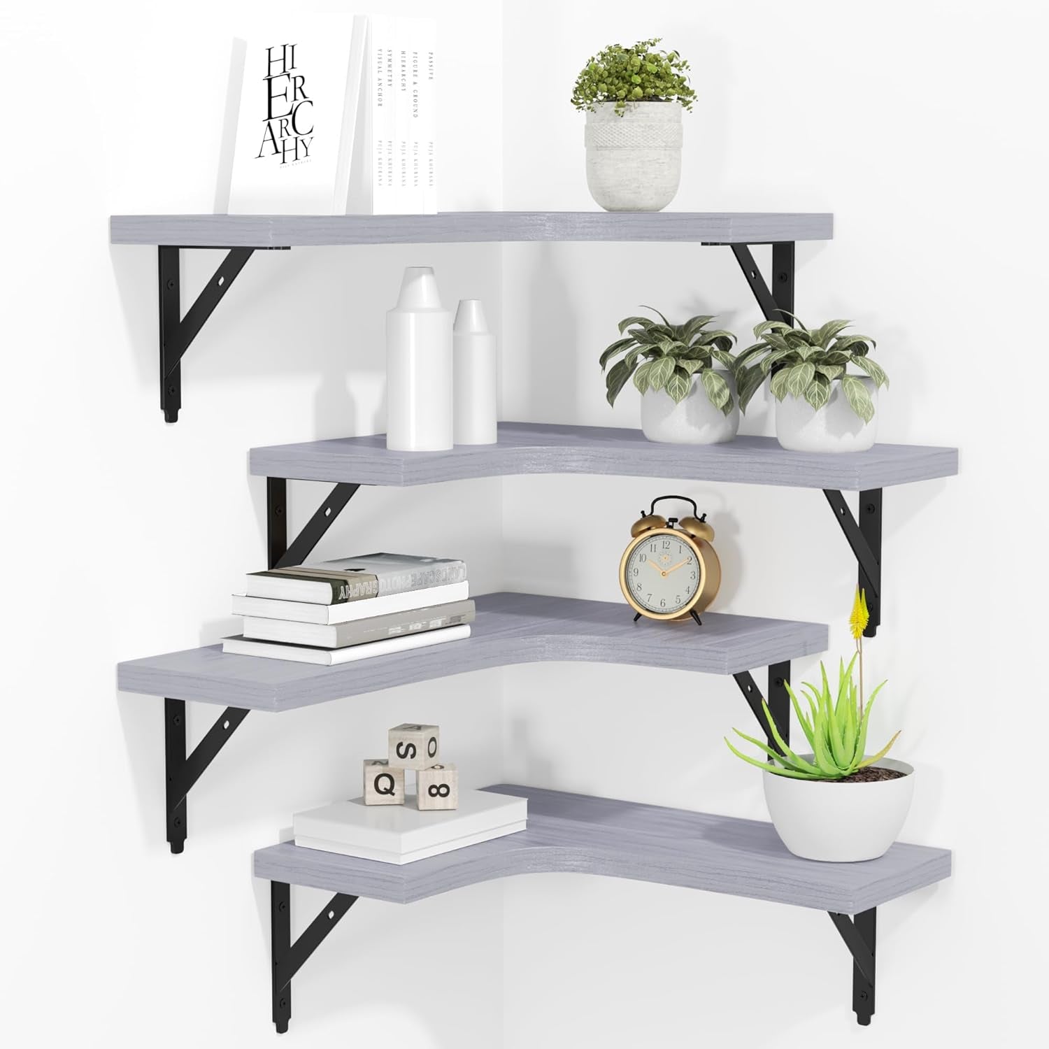 Corner display of four gray wood L-shaped floating shelves with black metal brackets and decor