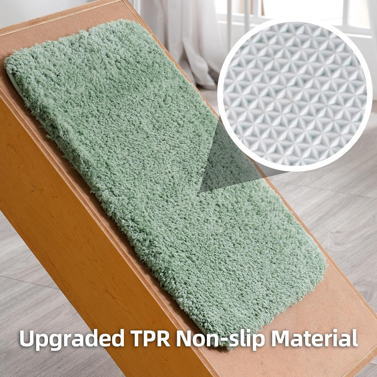 Leaf-green rectangular bath rug shown on an incline with magnified white textured non-slip backing