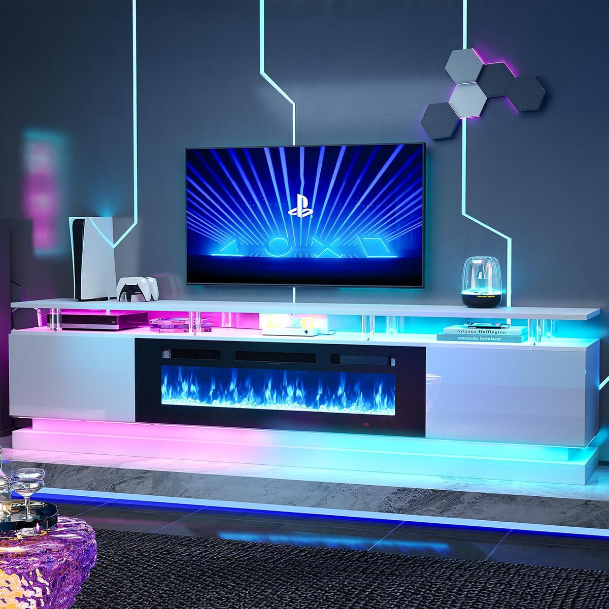 front-facing styled room view of white glossy TV stand with electric fireplace and cyan and magenta shelf lighting