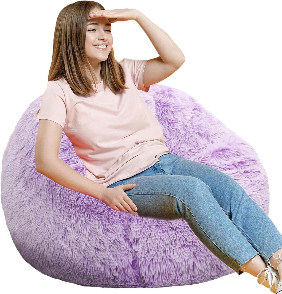Teen relaxed and leaning back on a lavender fluffy round bean bag, hand shading eyes from light.