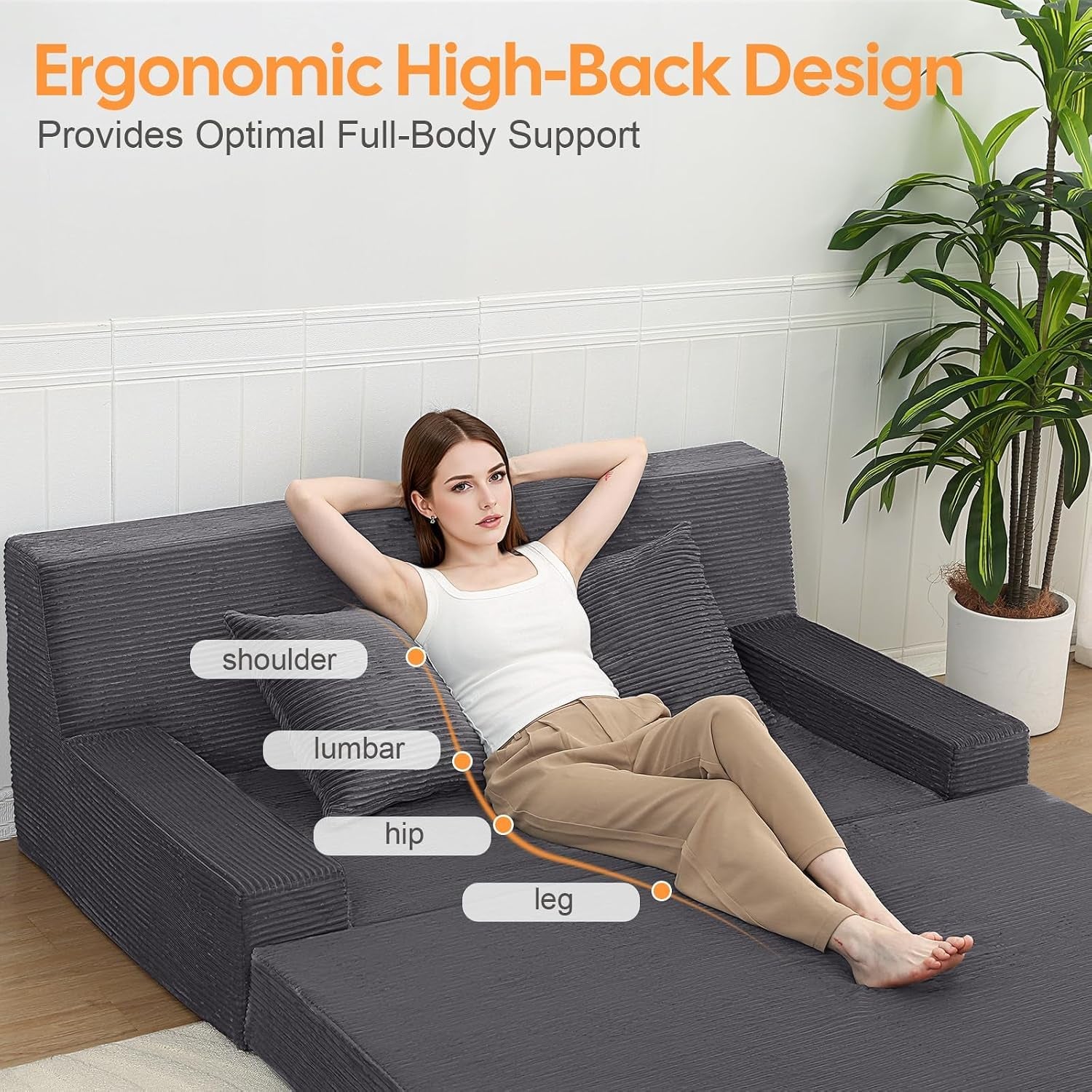 Woman reclining on the grey corduroy fold-out floor couch showing high-back ergonomic support