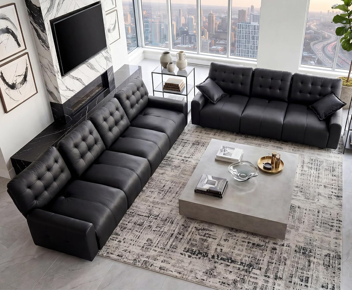 Overhead living room view showing two large tufted leather sofas arranged around a square coffee table.