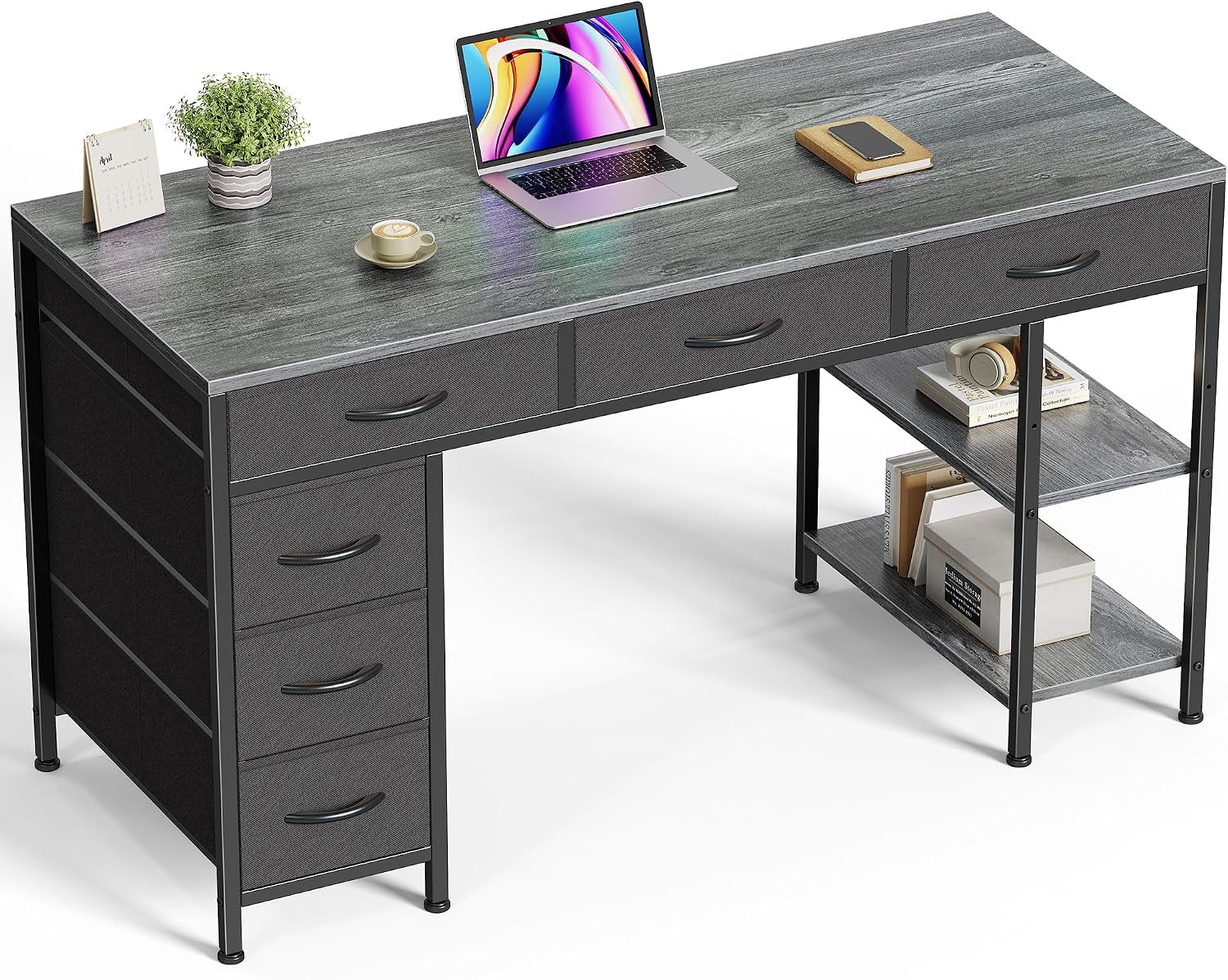 Studio image of the desk in a gray finish on a white background with decorative items.