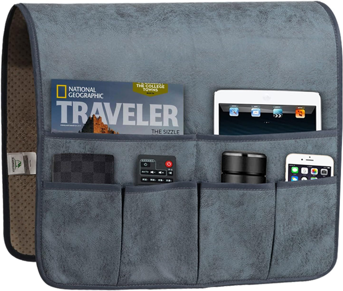 Front view of grey faux-leather armrest organizer with six pockets holding a magazine, tablet, remote, phone and small items.