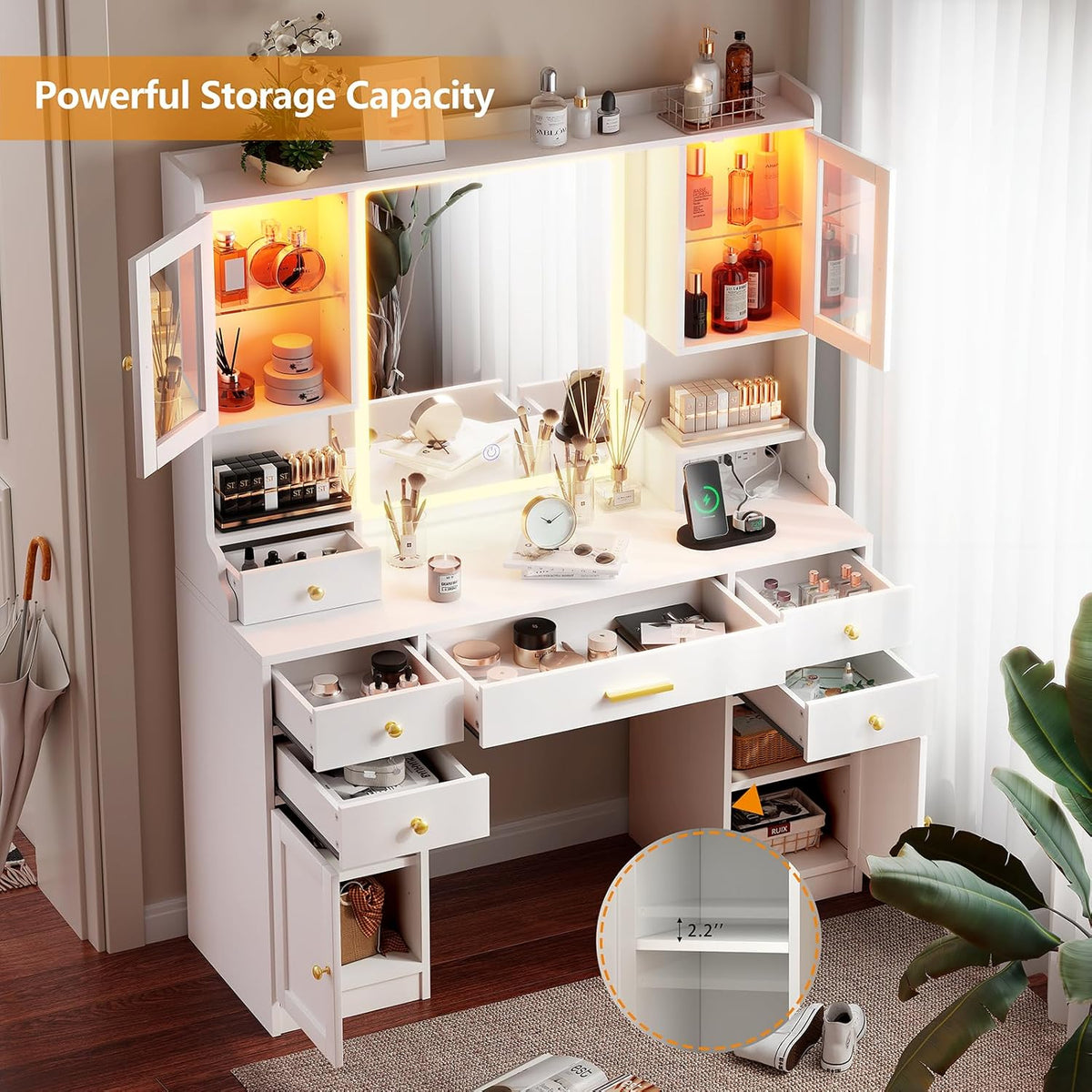 White vanity desk with drawers and cabinets open to show multi-compartment storage and interior shelving around the LEDmirror
