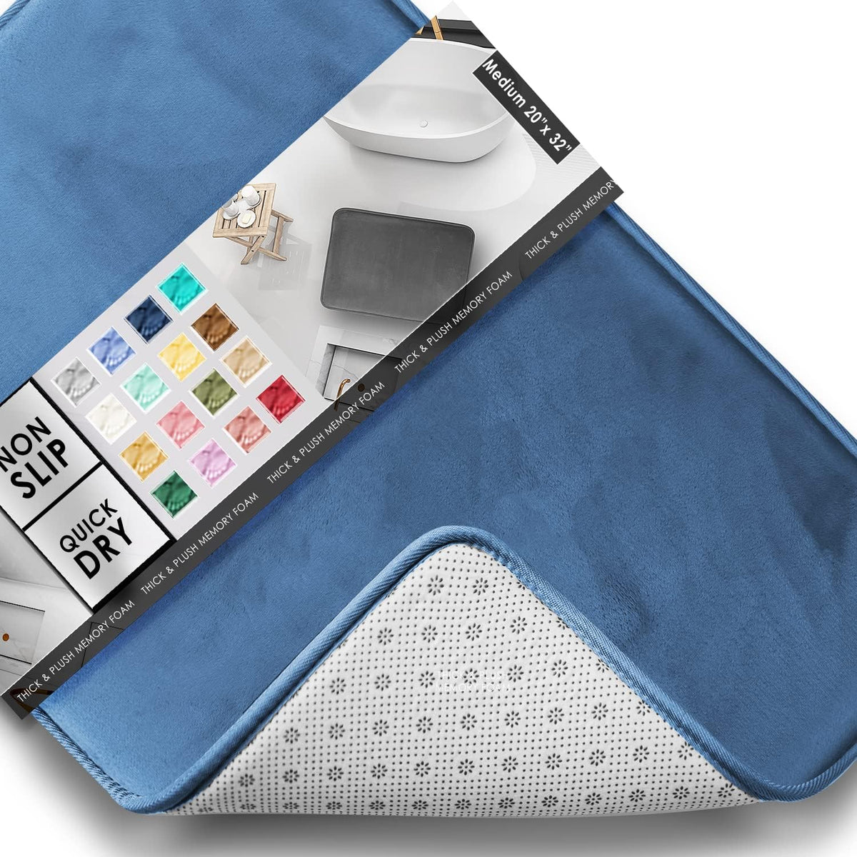 Tilted close-up of a denim-blue contour bath mat showing velvet surface, packaging label and flipped corner with non-slip