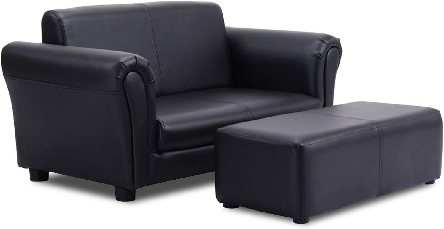 Two-seat black upholstered sofa shown with a matching rectangular ottoman on short legs, angled view.