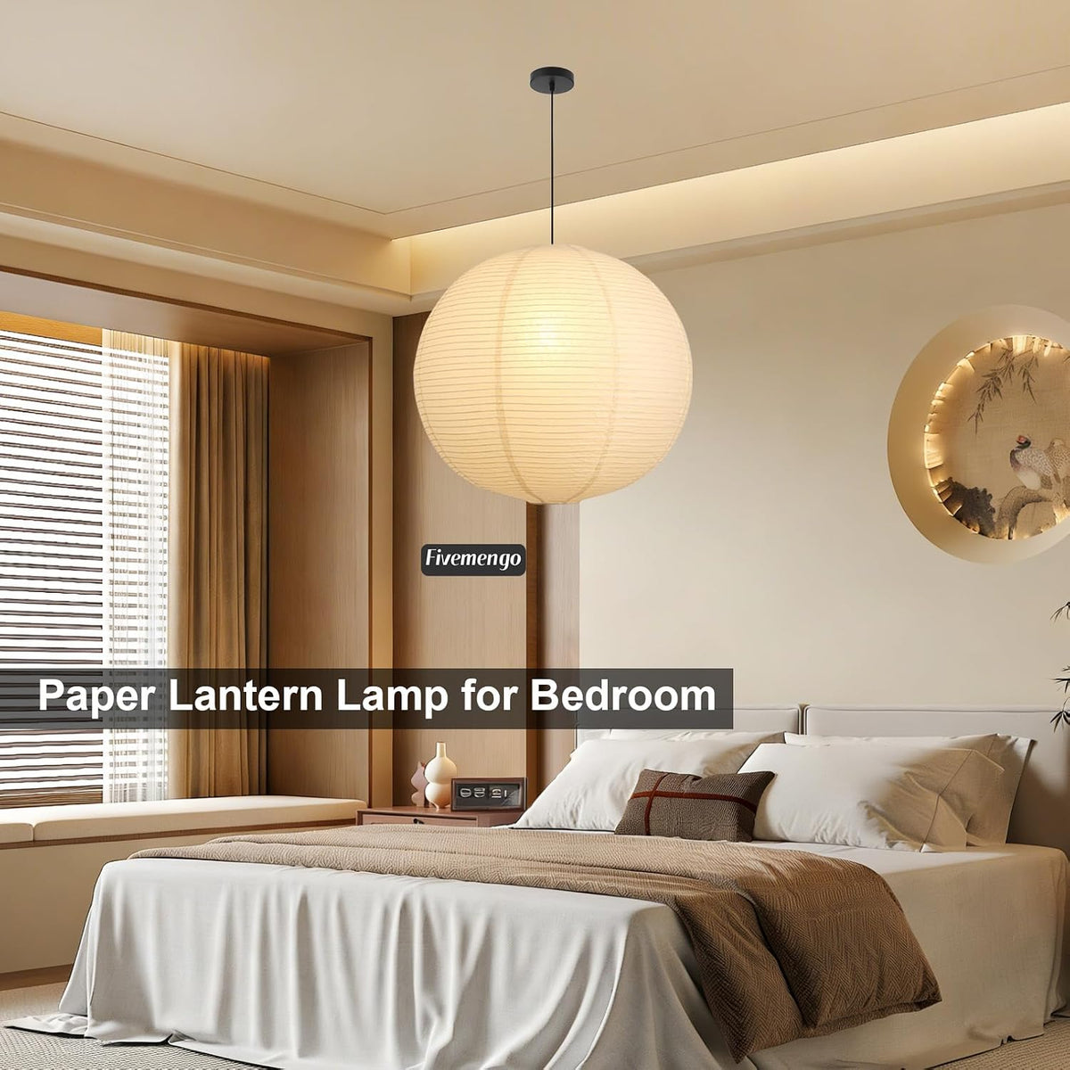 Off-white spherical paper pendant suspended over a bed in a styled bedroom interior