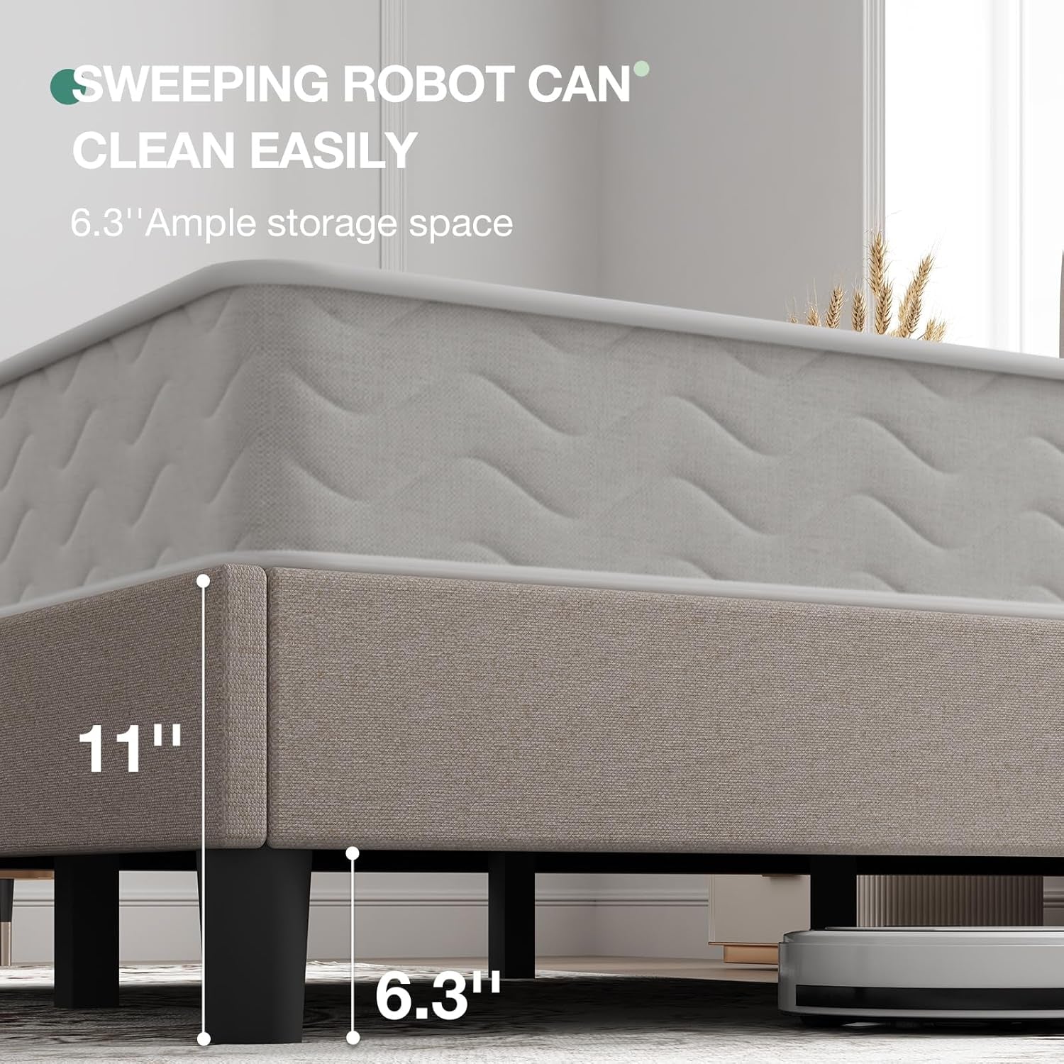 Side close-up of the taupe bed frame showing 6.3-inch floor clearance beside a robot vacuum.