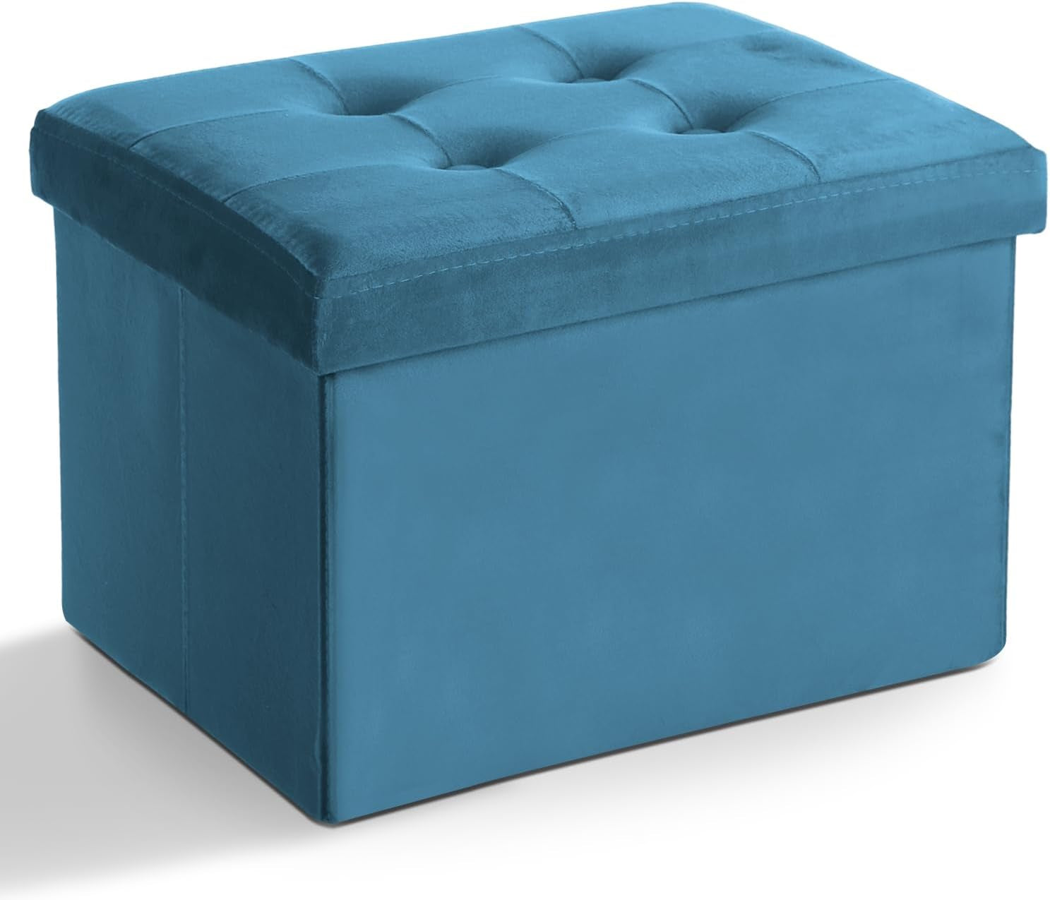 Three-quarter front view of a tufted rectangular blue fabric storage ottoman on a white background.