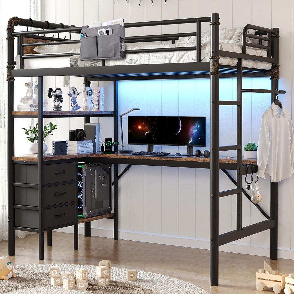 Twin loft bed with black metal frame, L-shaped wood-finish desk, blue LED backlighting, monitors and three-drawer cabinet