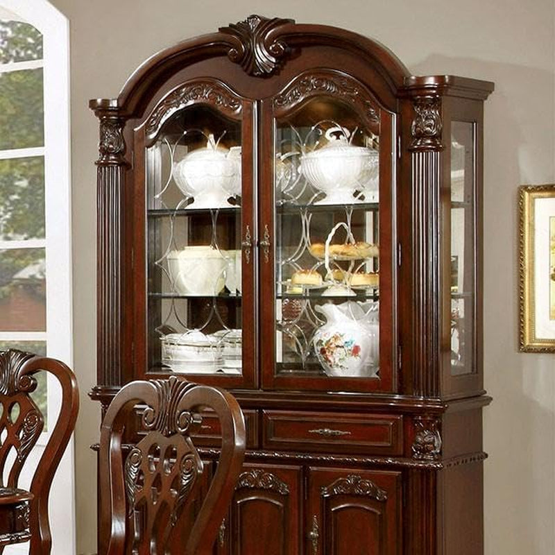 Close front view of brown cherry hutch showing glass display doors, carved column details, and interior shelving
