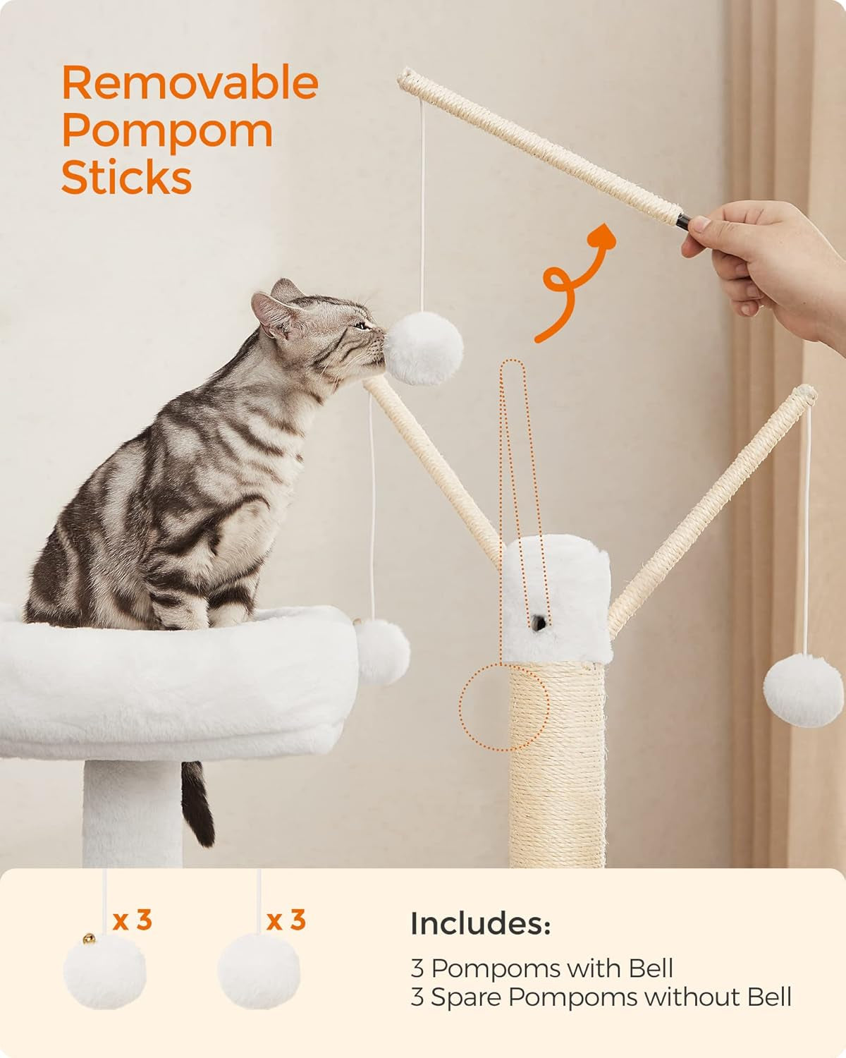 Cat sniffing a hanging pompom while a hand detaches a sisal-wrapped pompom stick from the top post.