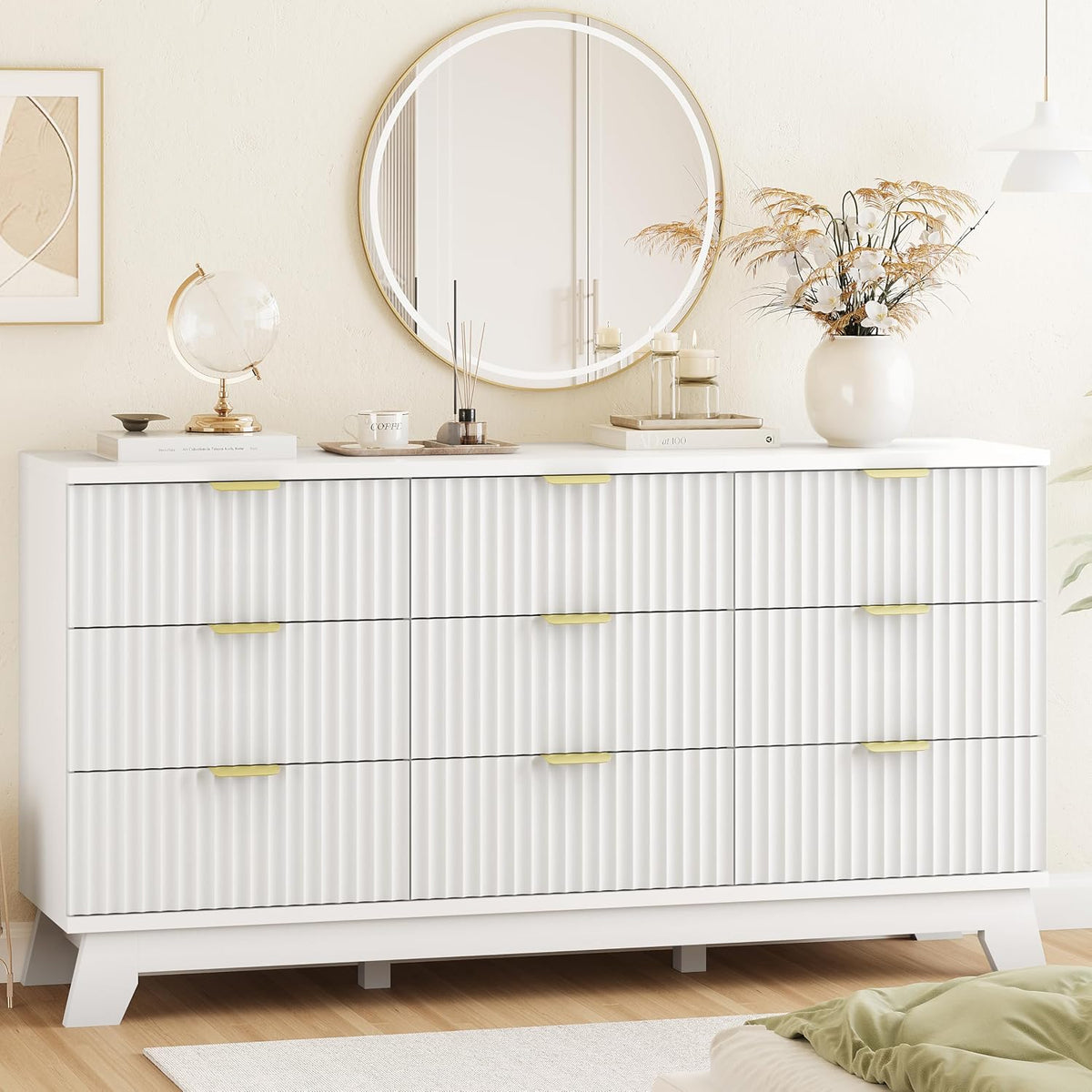 White wave-fluted dresser chest front angled view with gold coated handles and round mirror above