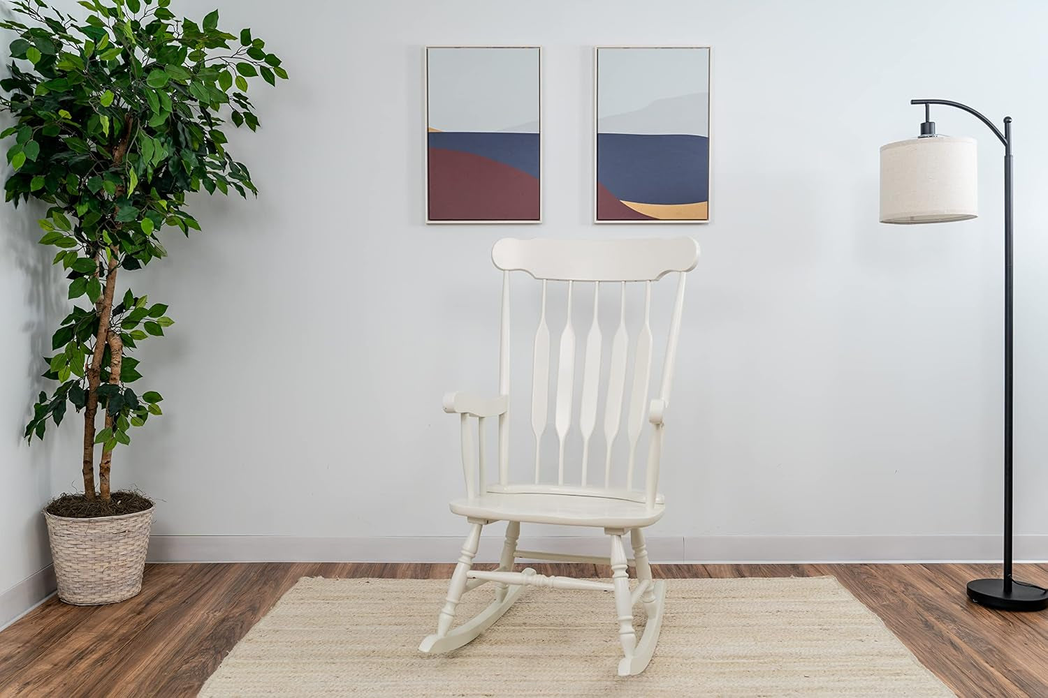 White wooden rocking chair in a staged living room showing full back, armrests and curved rockers